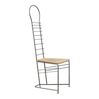 Vintage sculptural steel and straw chair