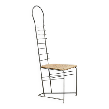 Vintage sculptural steel and straw chair