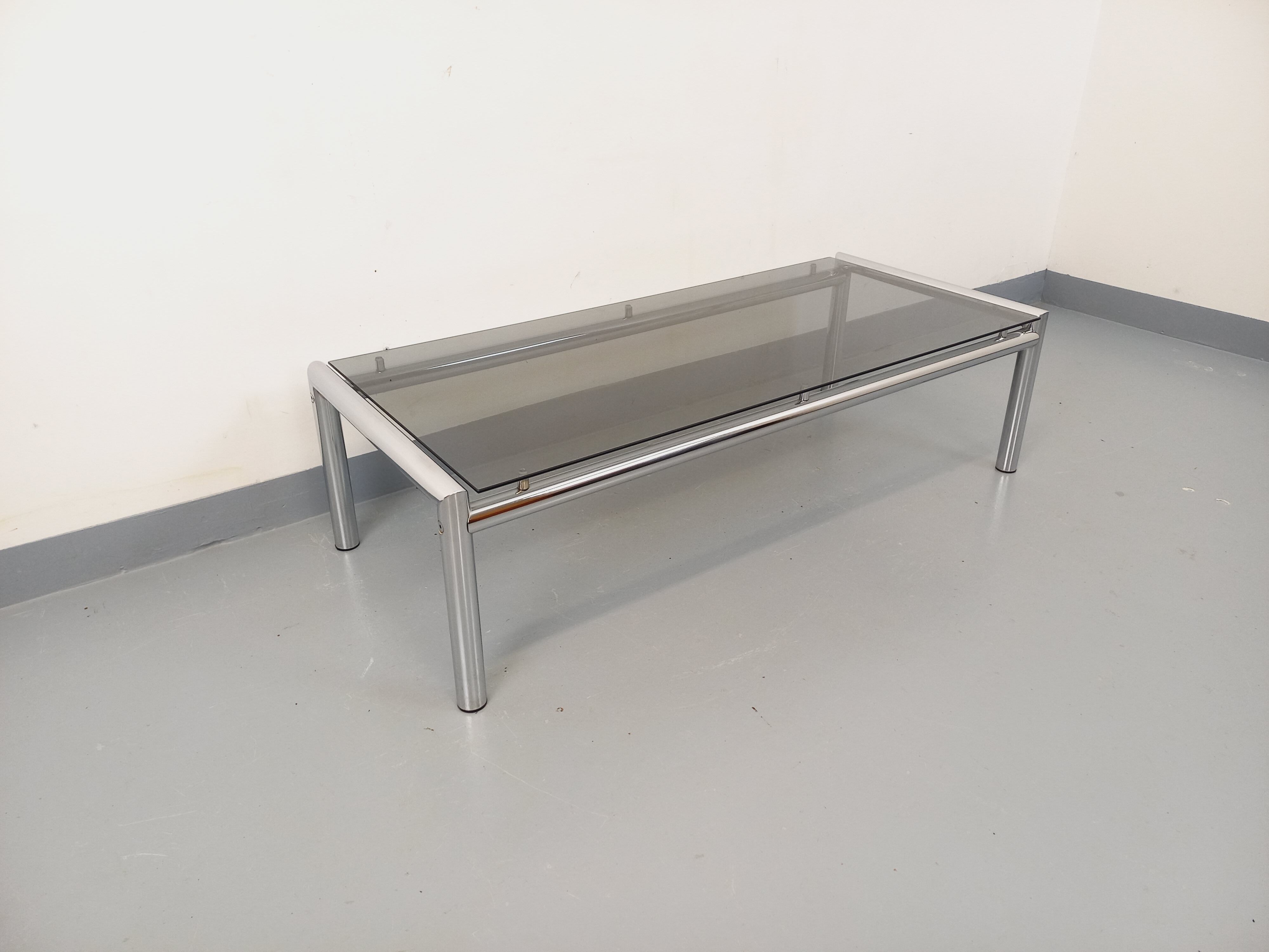 Vintage rectangular coffee table in smoked glass and chrome metal from the 1960s.
