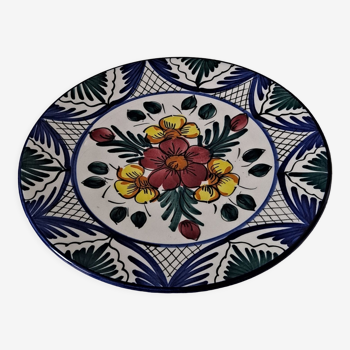 Flat flowery plate in earthenware of Manises