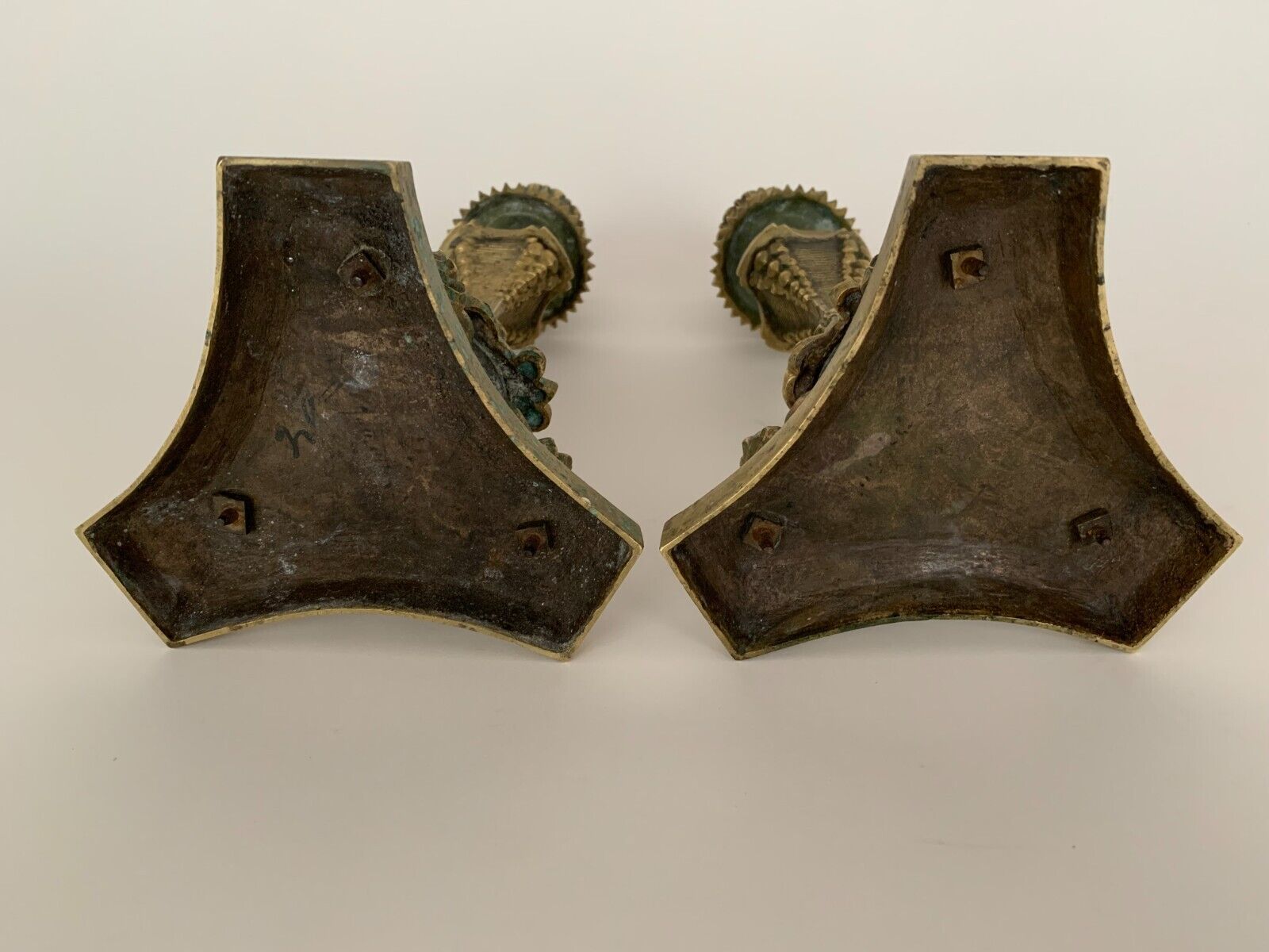 Pair of bronze candle holders with neogothic nineteenth chiseling