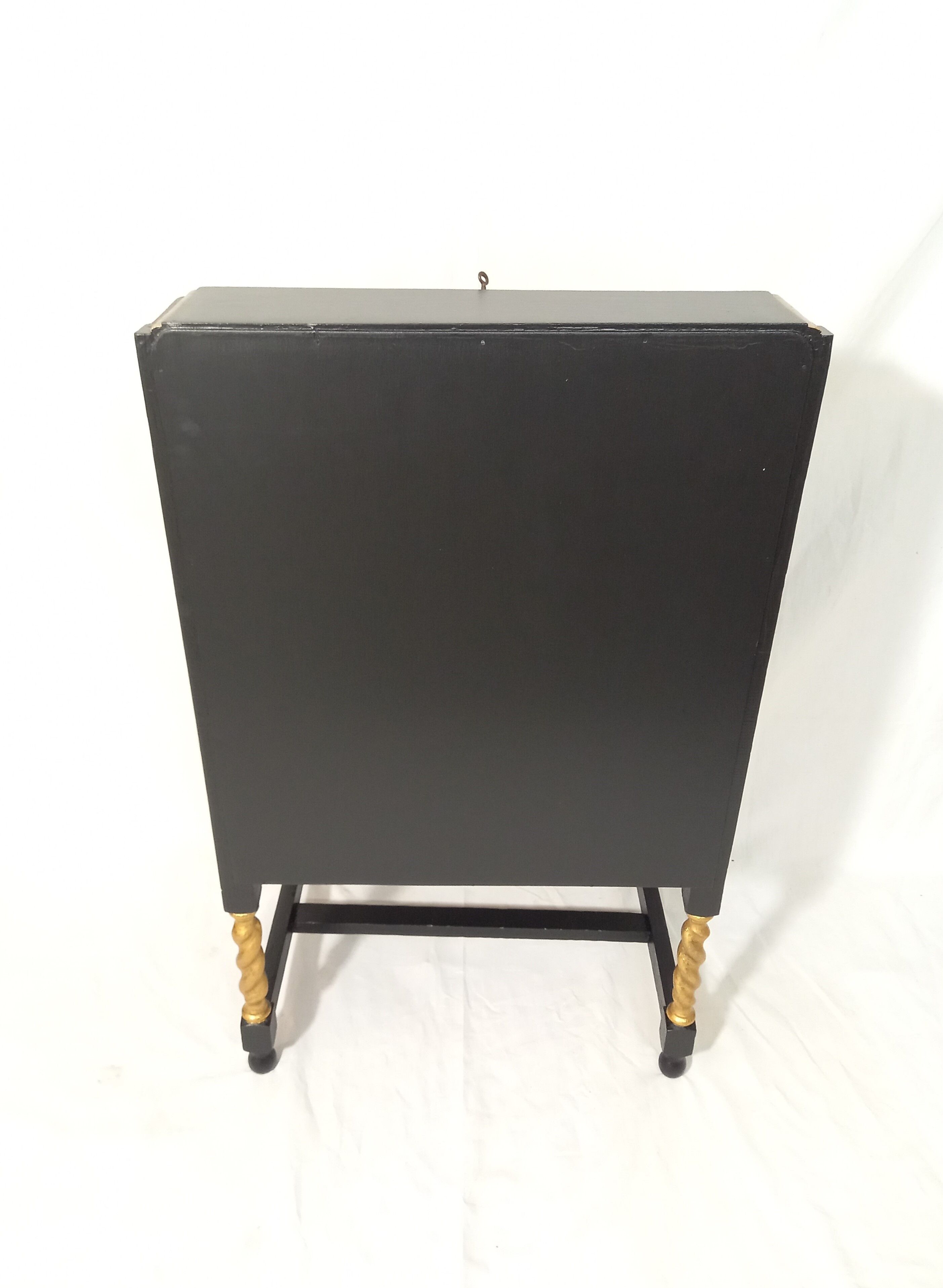 Small secretary with black and gold lid