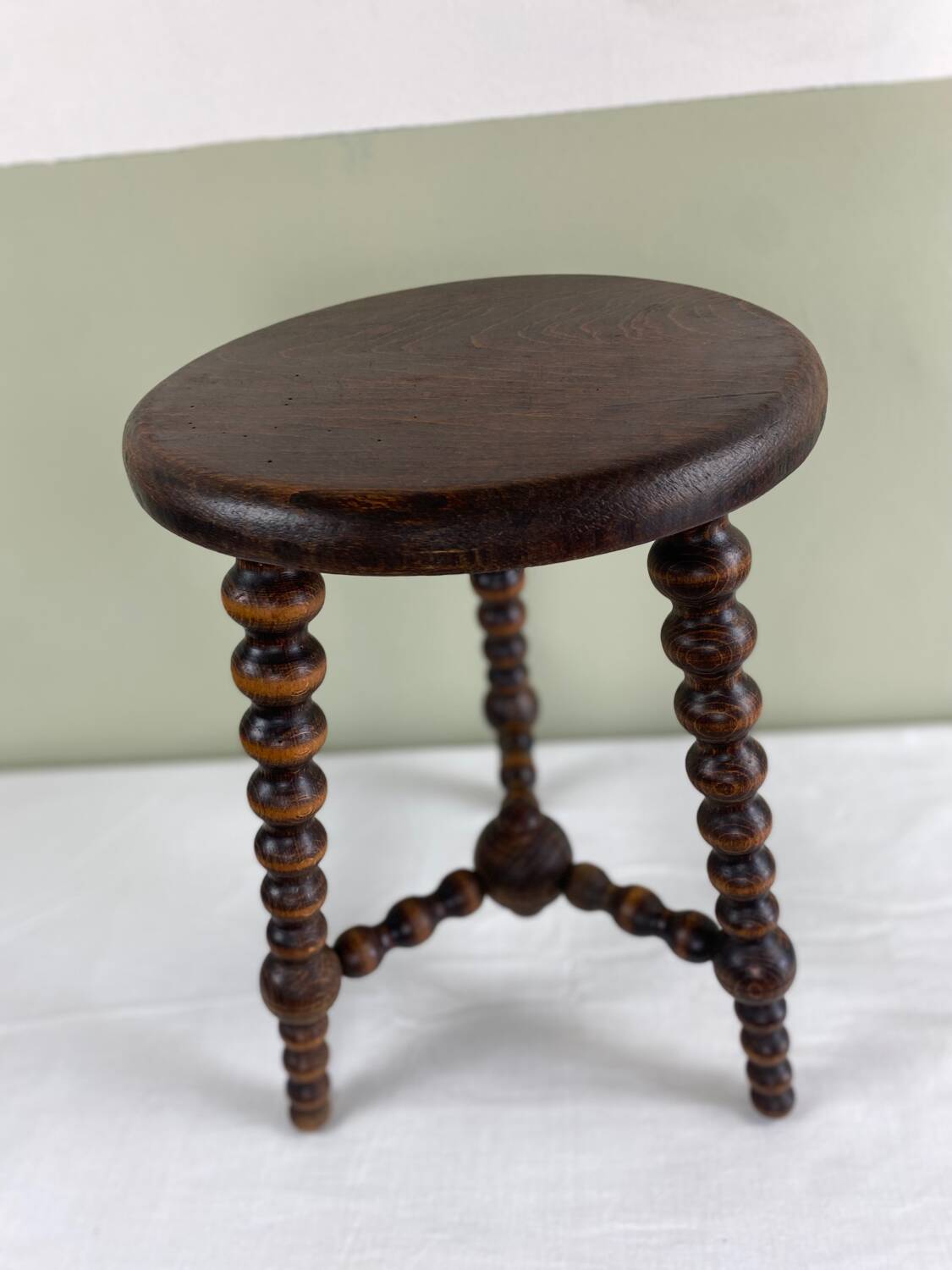 Signed turned wood tripod stool