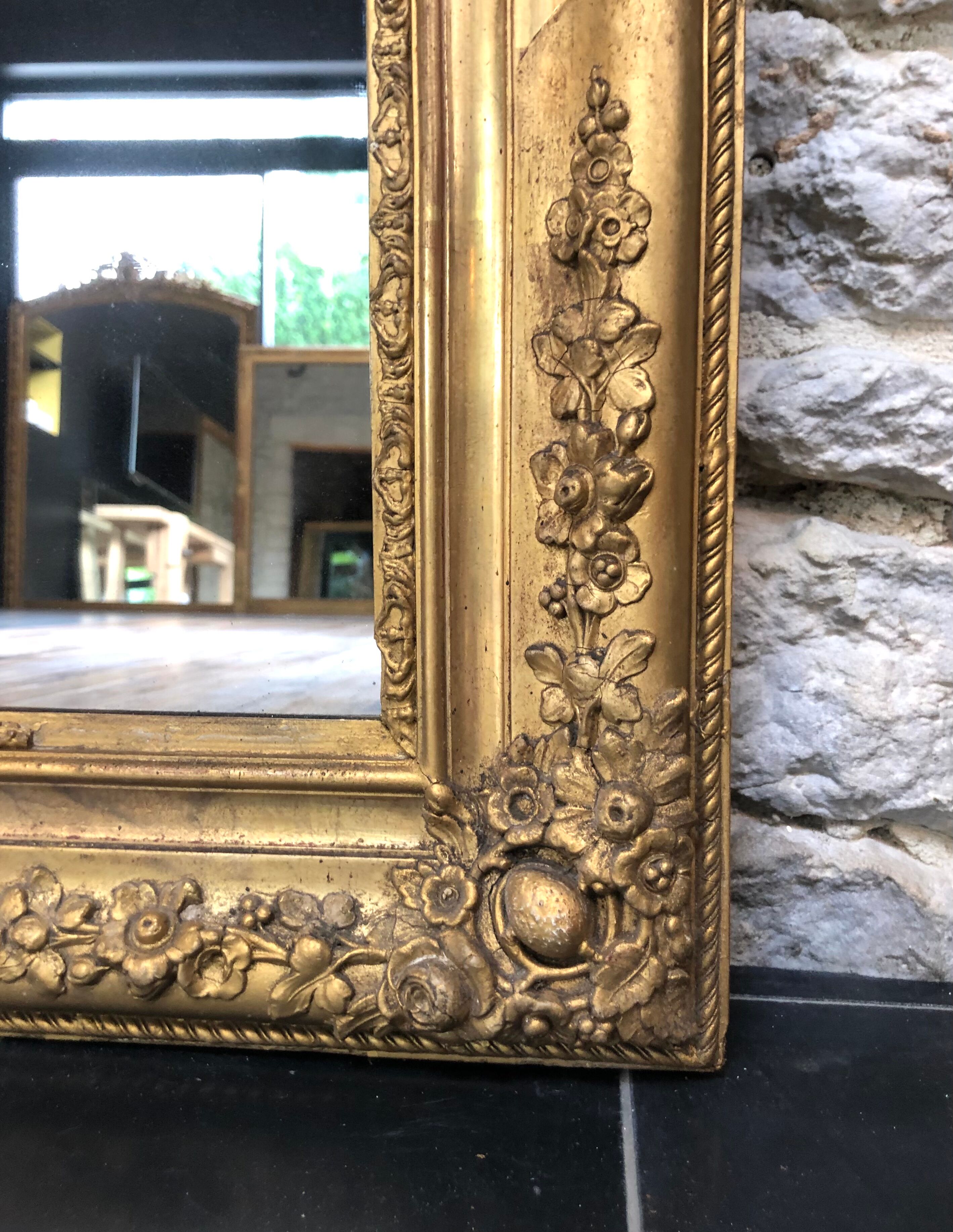 Mirror Louis-Philippe floral decoration period 19th gilded with gold leaf 102cm / 77,5cm
