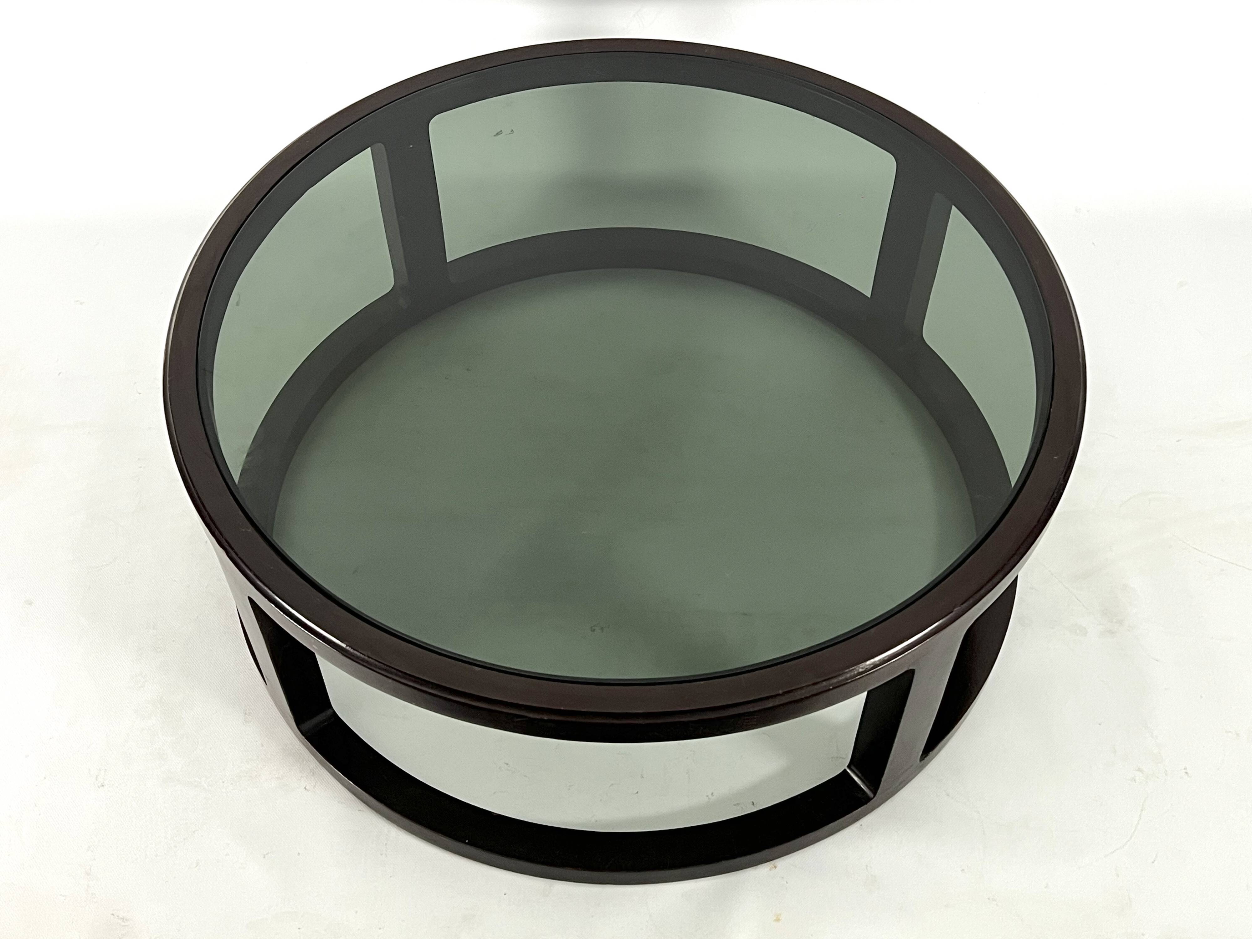 Italian Vintage Large Round coffee table in wood and fume glass. 1970s