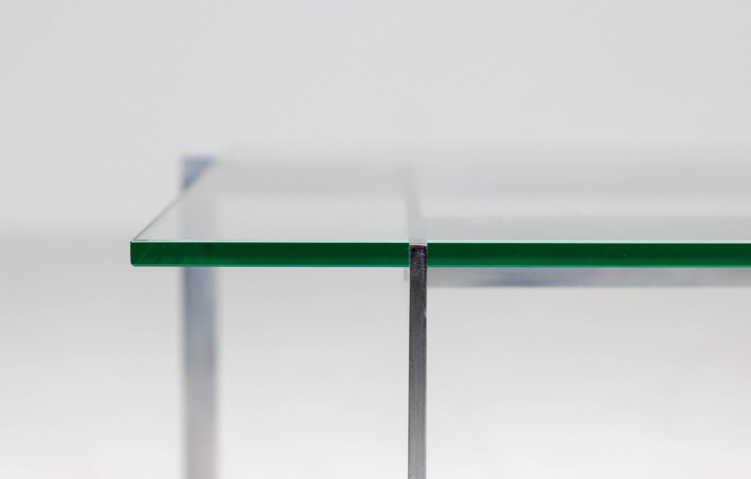 Architectural rectangular coffee table in steel and glass.