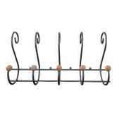 Old wall-mounted wrought iron coat rack