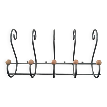 Old wall-mounted wrought iron coat rack