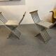 Pair of curule chairs designed by John Vesey, 1958, USA, brushed aluminum, walnut and leather