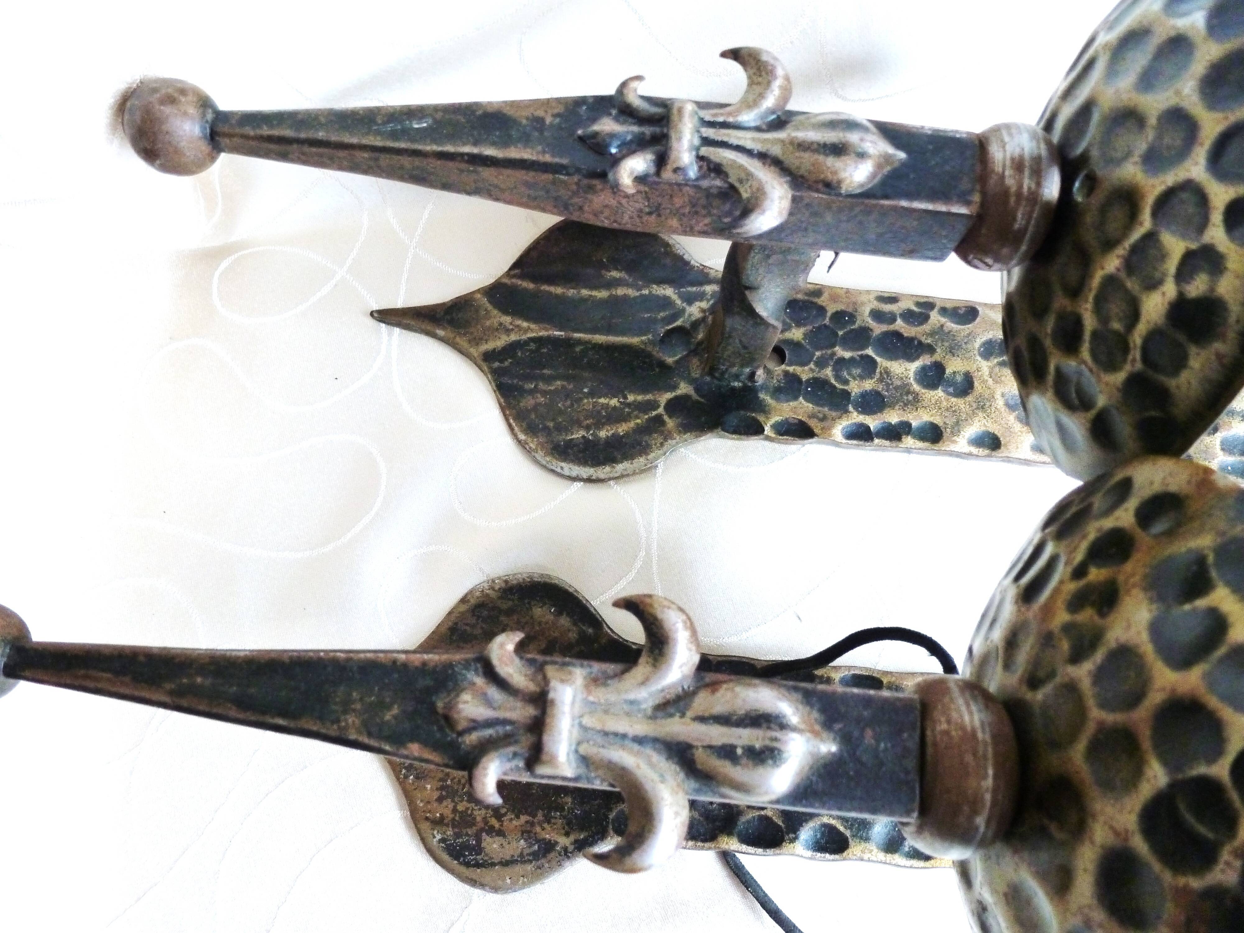 Medieval wrought iron wall lights / antique medieval lighting.