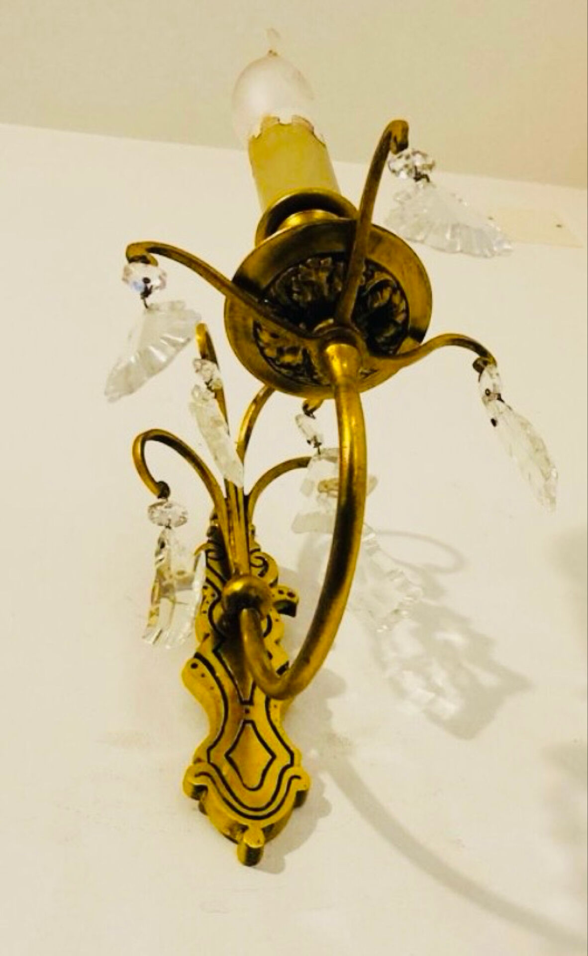 Brass wall light with glass pendants from the mid-20th century.