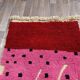 Handmade pure wool rug in pink, size 150 x 250 cm.