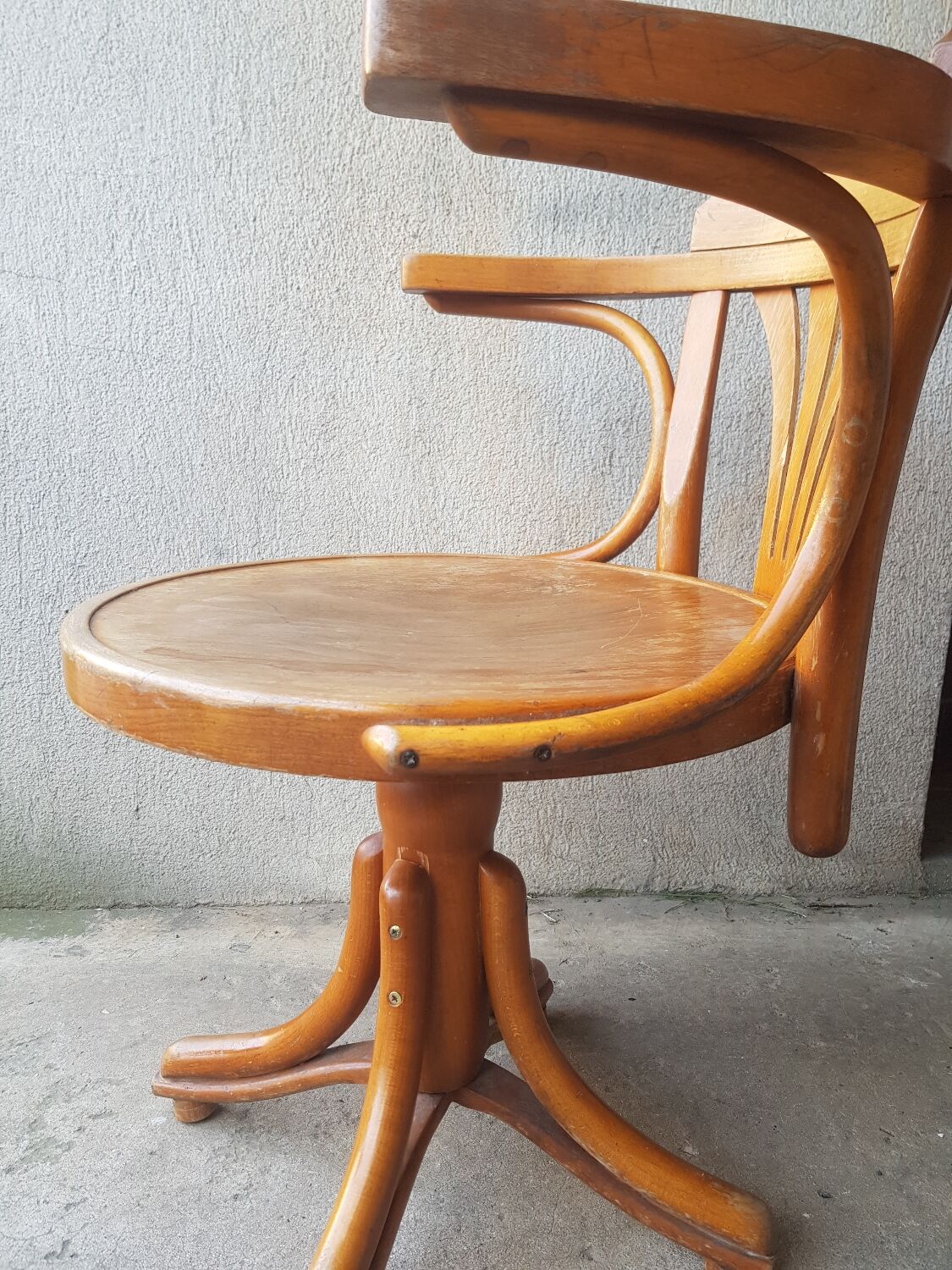 Swivel wooden armchair