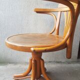 Swivel wooden armchair