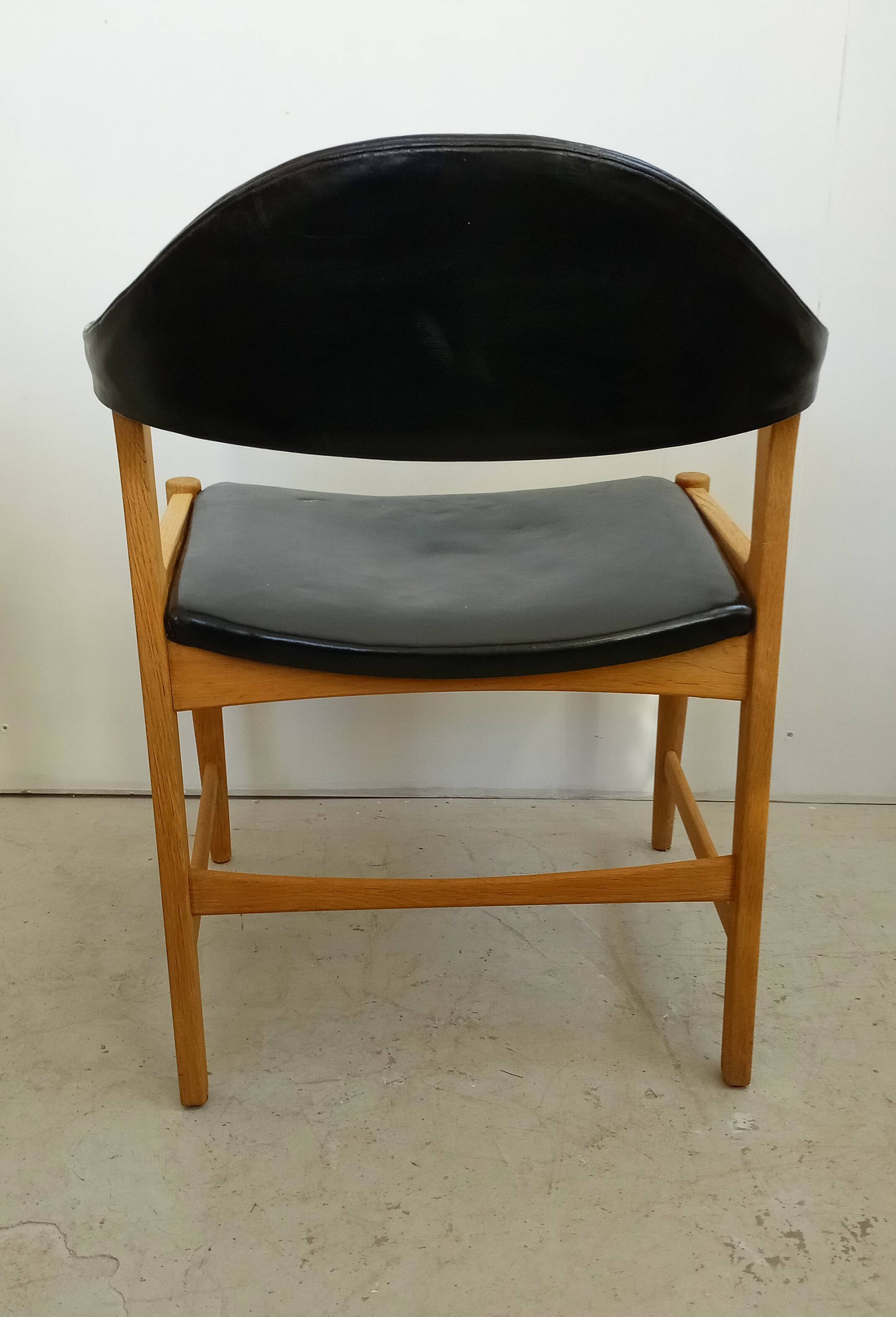 Danish armchair in oak and black leather