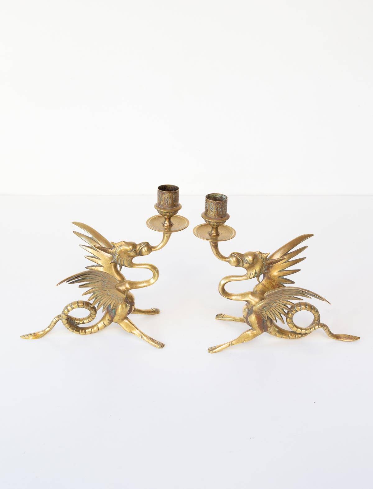 Pair of 19th century gilded brass “chimera” candlesticks