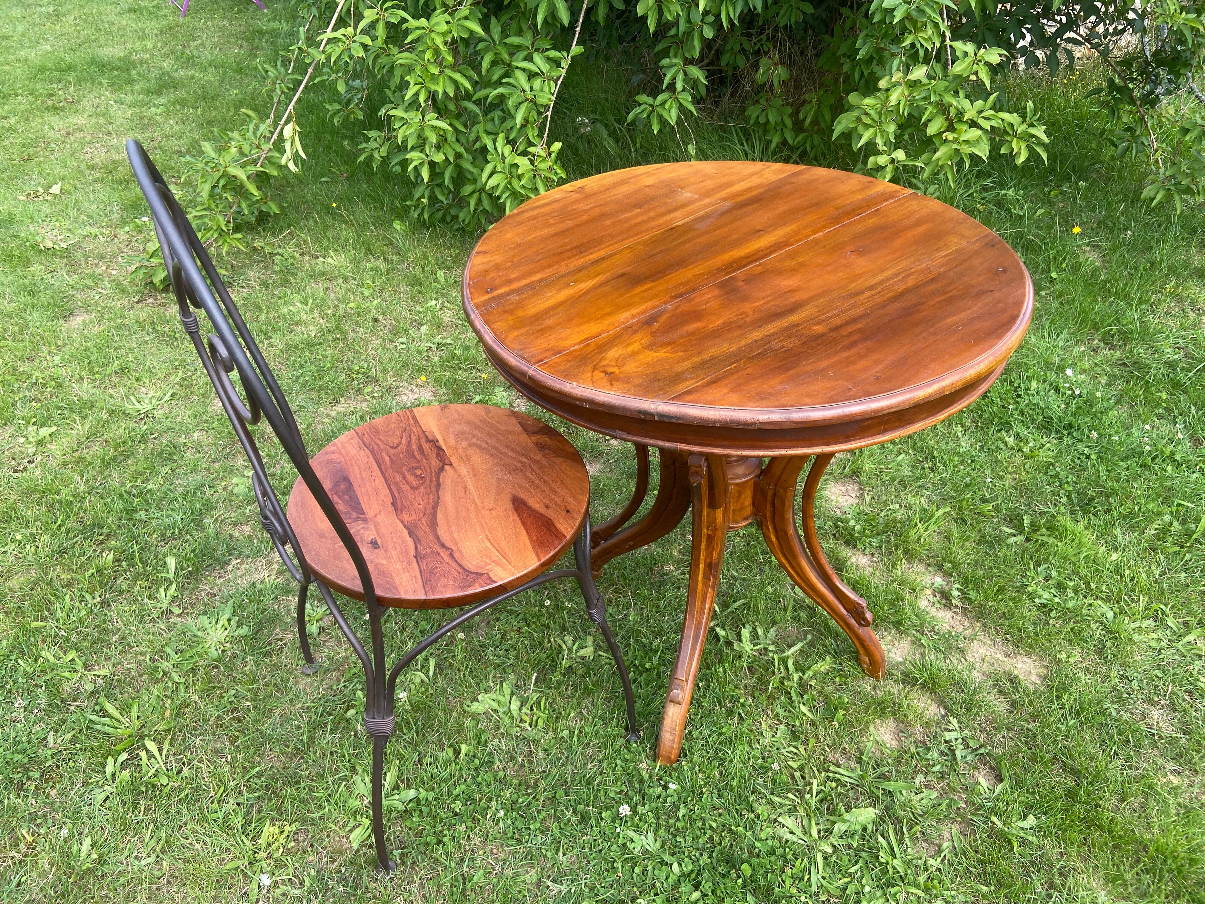 Round table and wrought iron chair