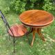 Round table and wrought iron chair