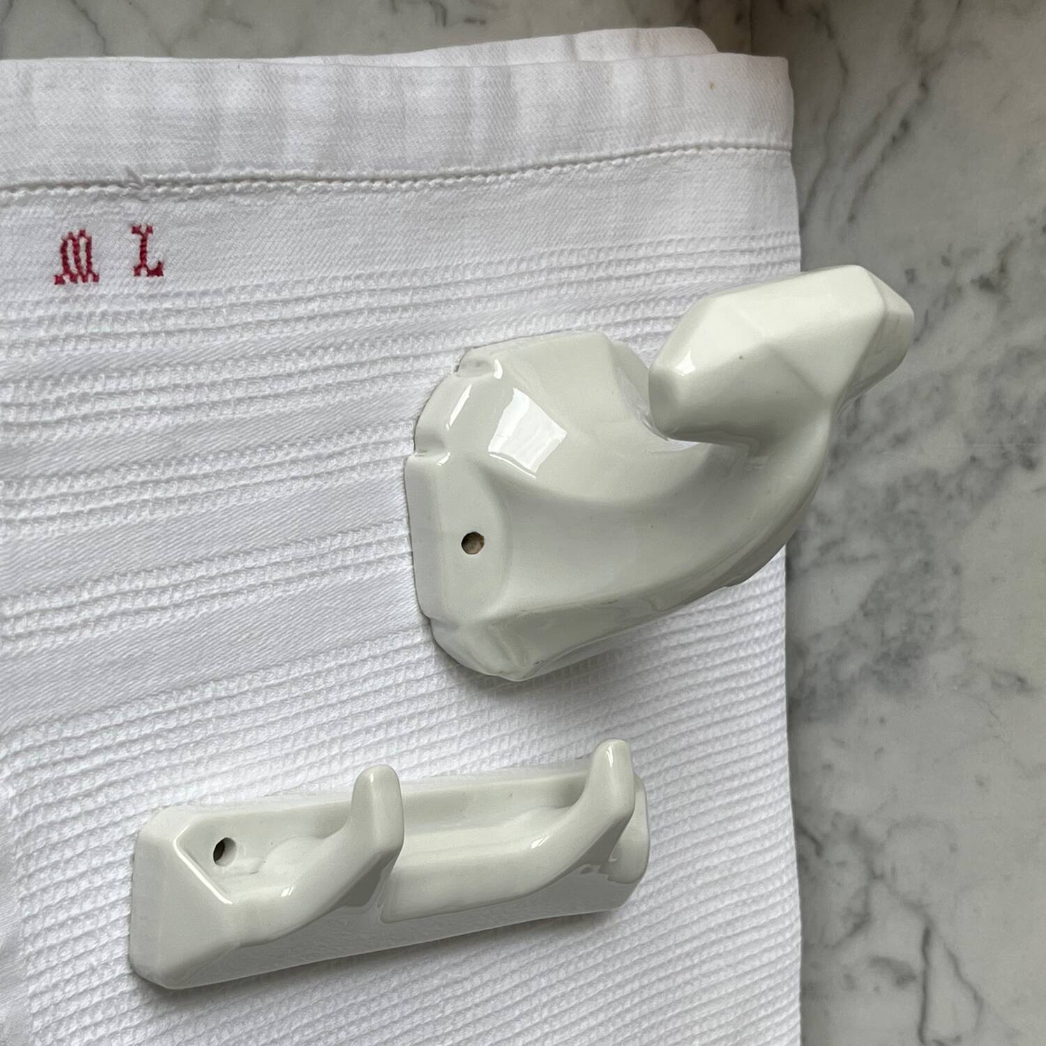 White porcelain coat hooks