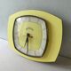 Pendule, Bayard wall clock in yellow formica from the 60s