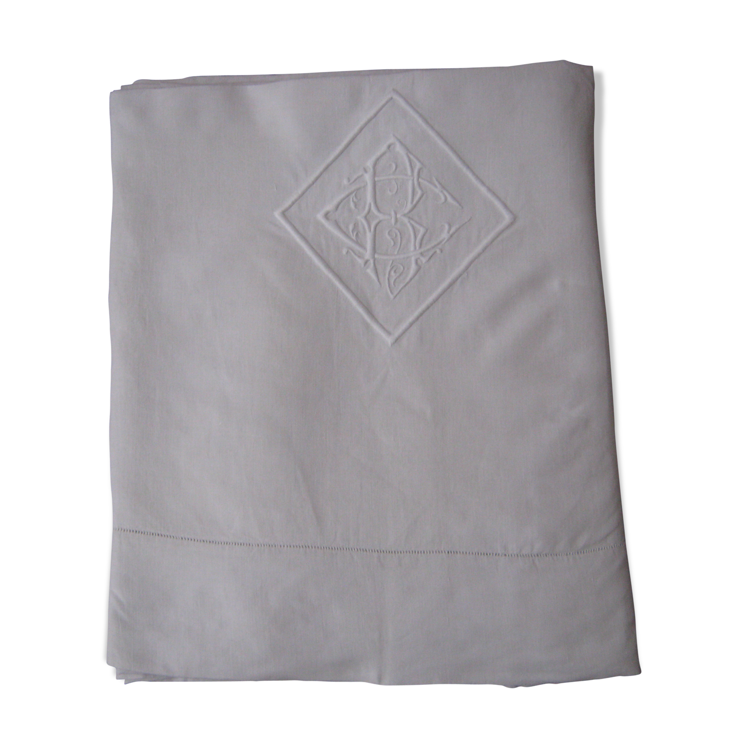 Old sheet in monogram white thread