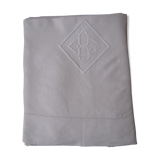 Old sheet in monogram white thread