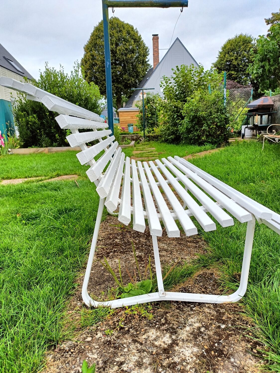 Antique garden bench with metal legs