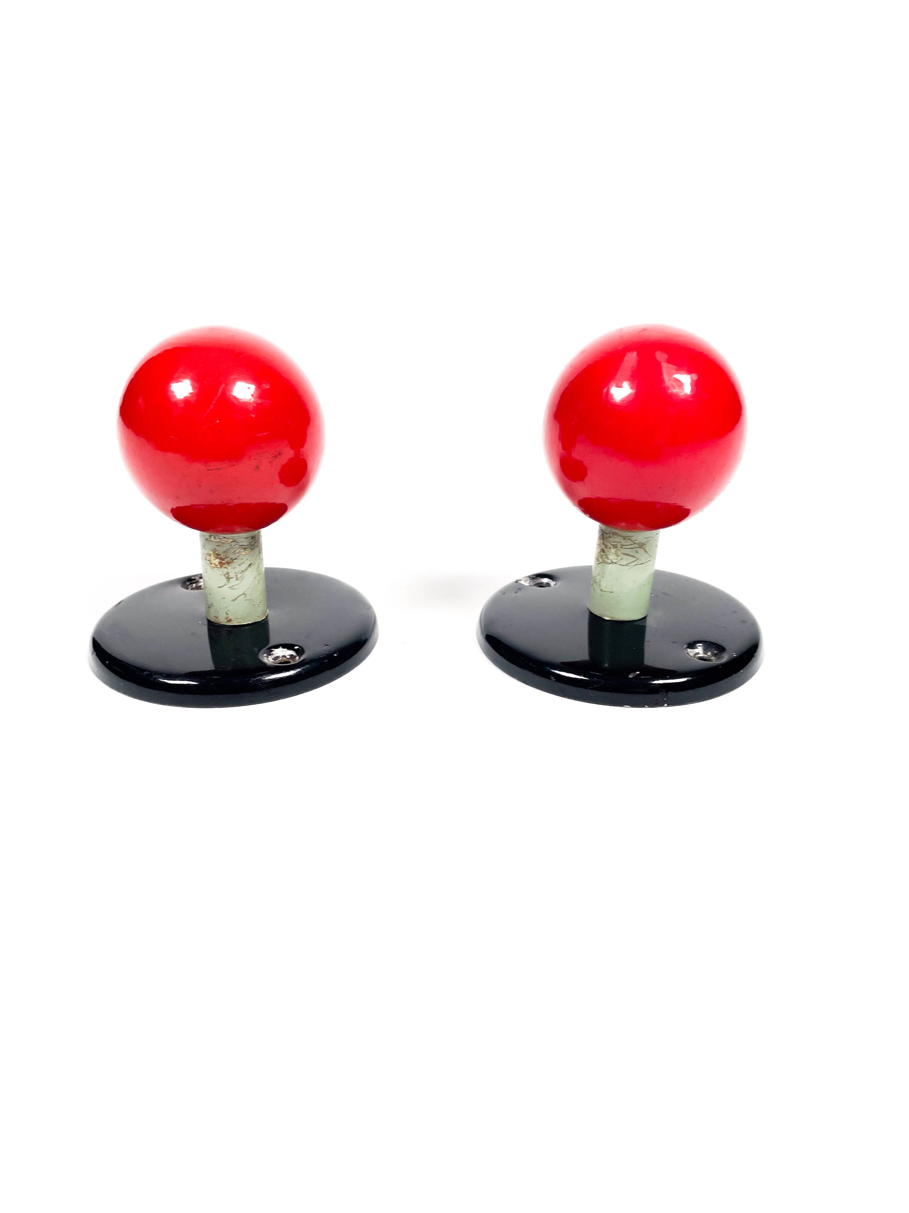 Vintage red enamel metal coat hooks