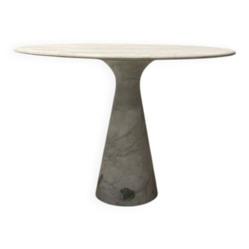 High side table with a marble base and travertine top.