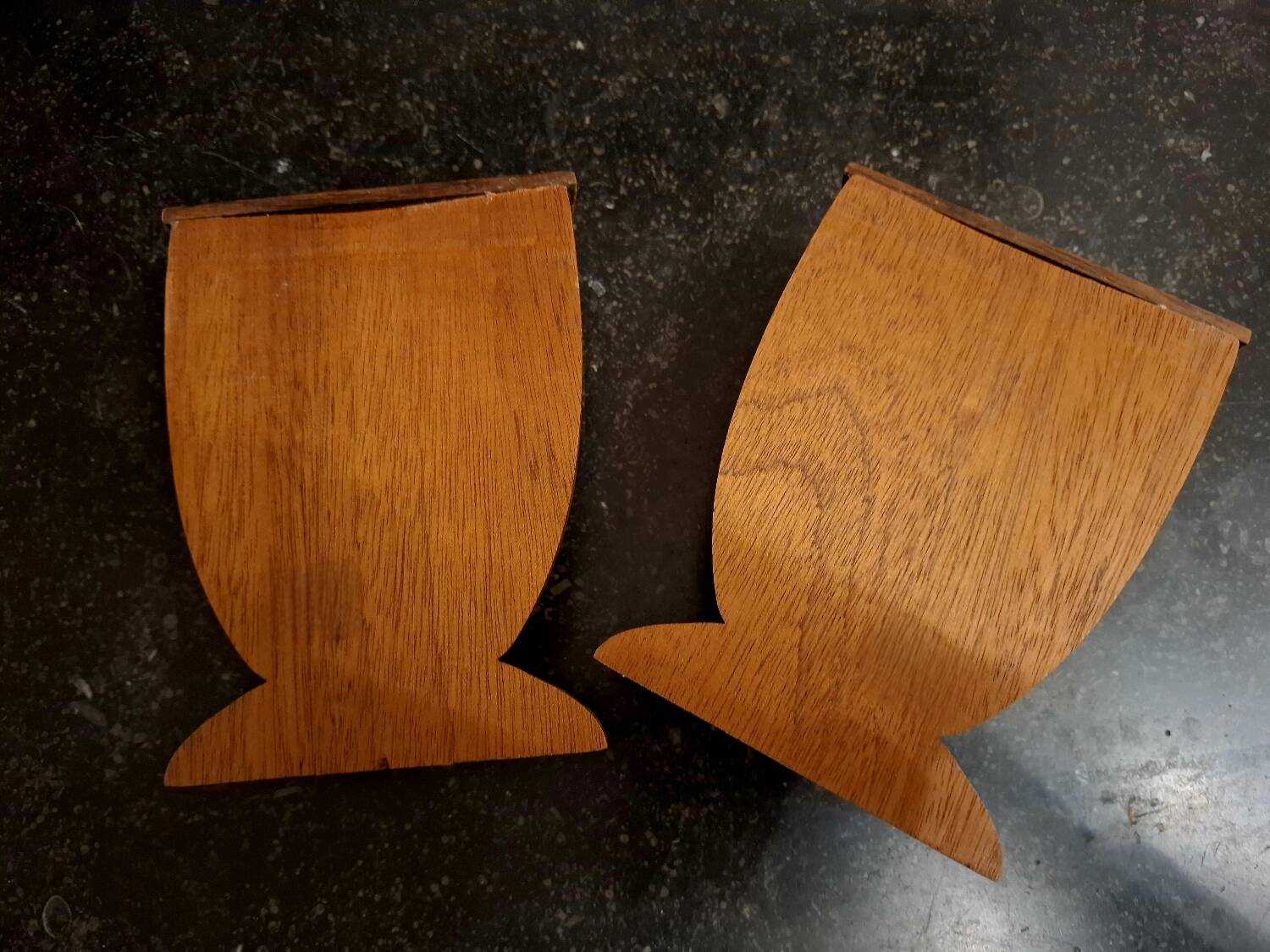 Bookends in exotic wood marquetry in the shape of a tambourine.