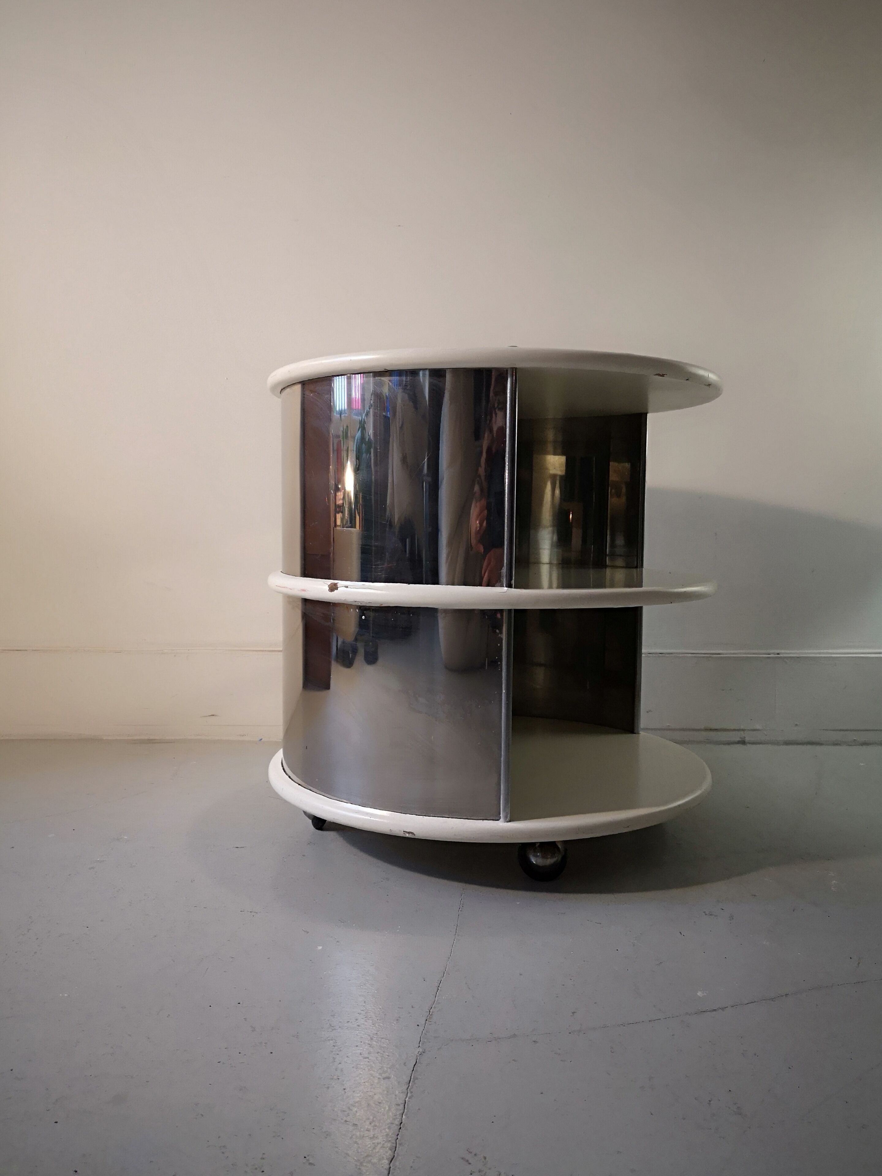 Pair of mirrored space age cylindrical bedside tables, 1960