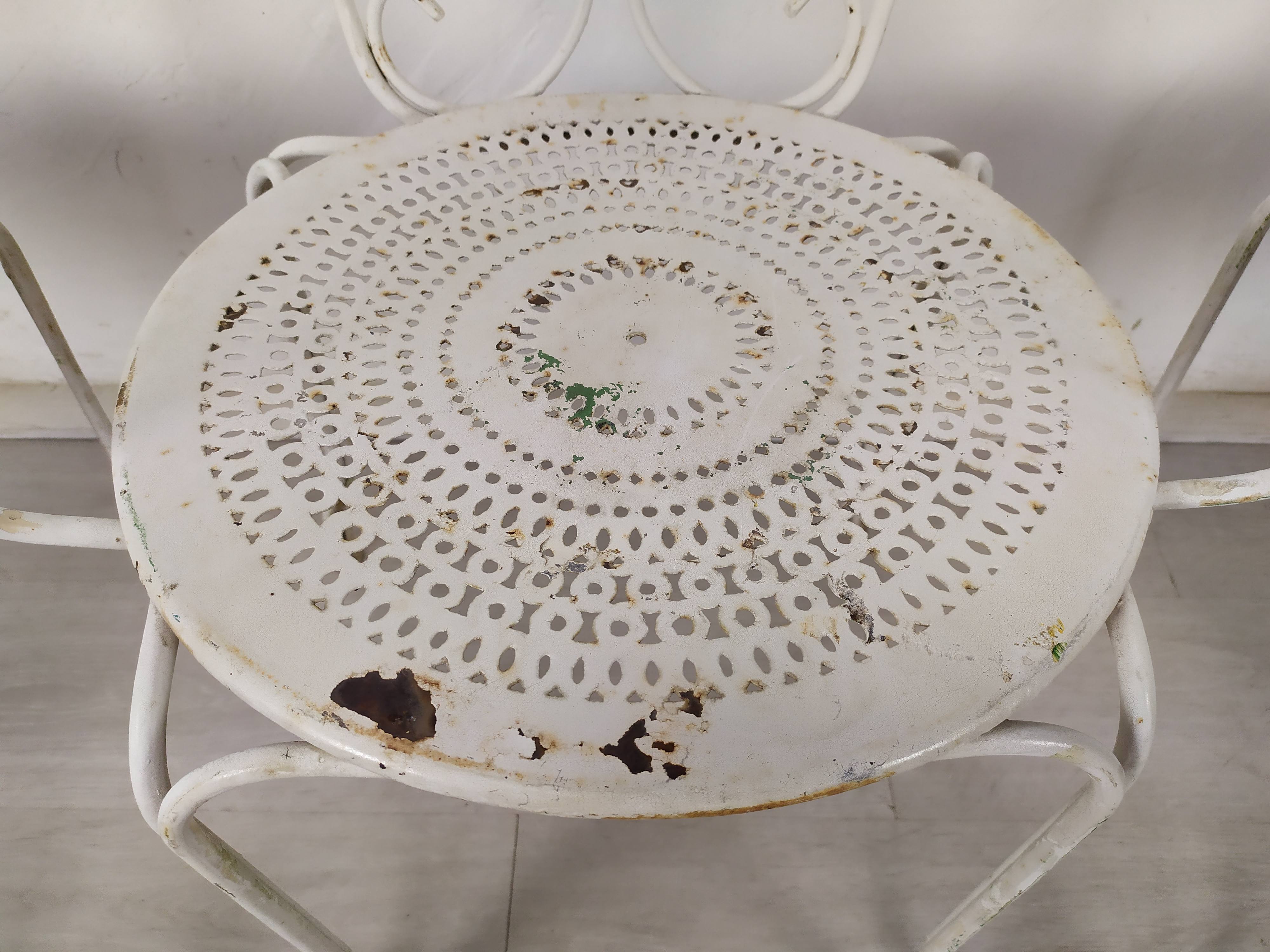 4 wrought iron garden armchairs