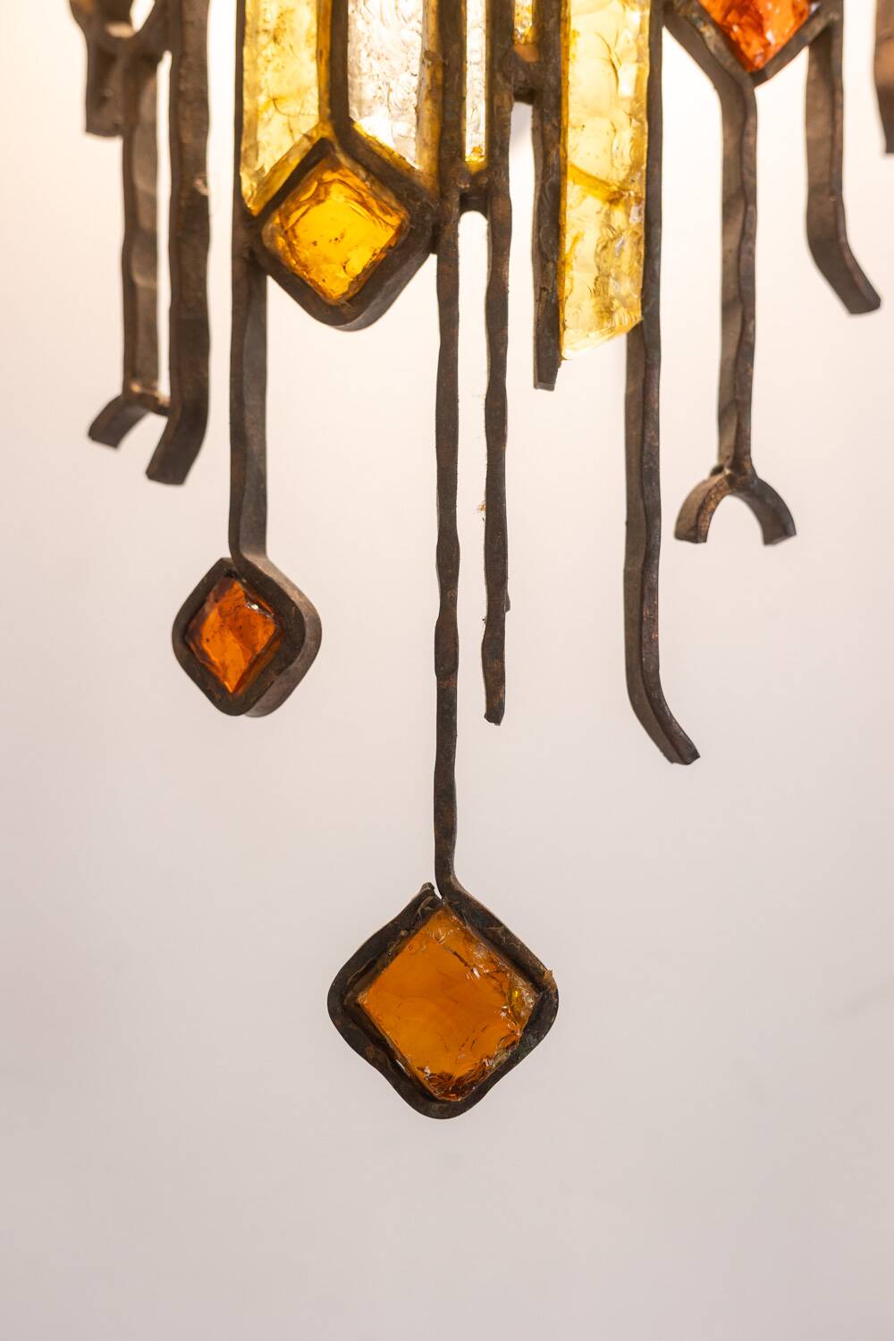 Wrought iron and colored glass wall light. 1960s.