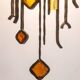 Wrought iron and colored glass wall light. 1960s.