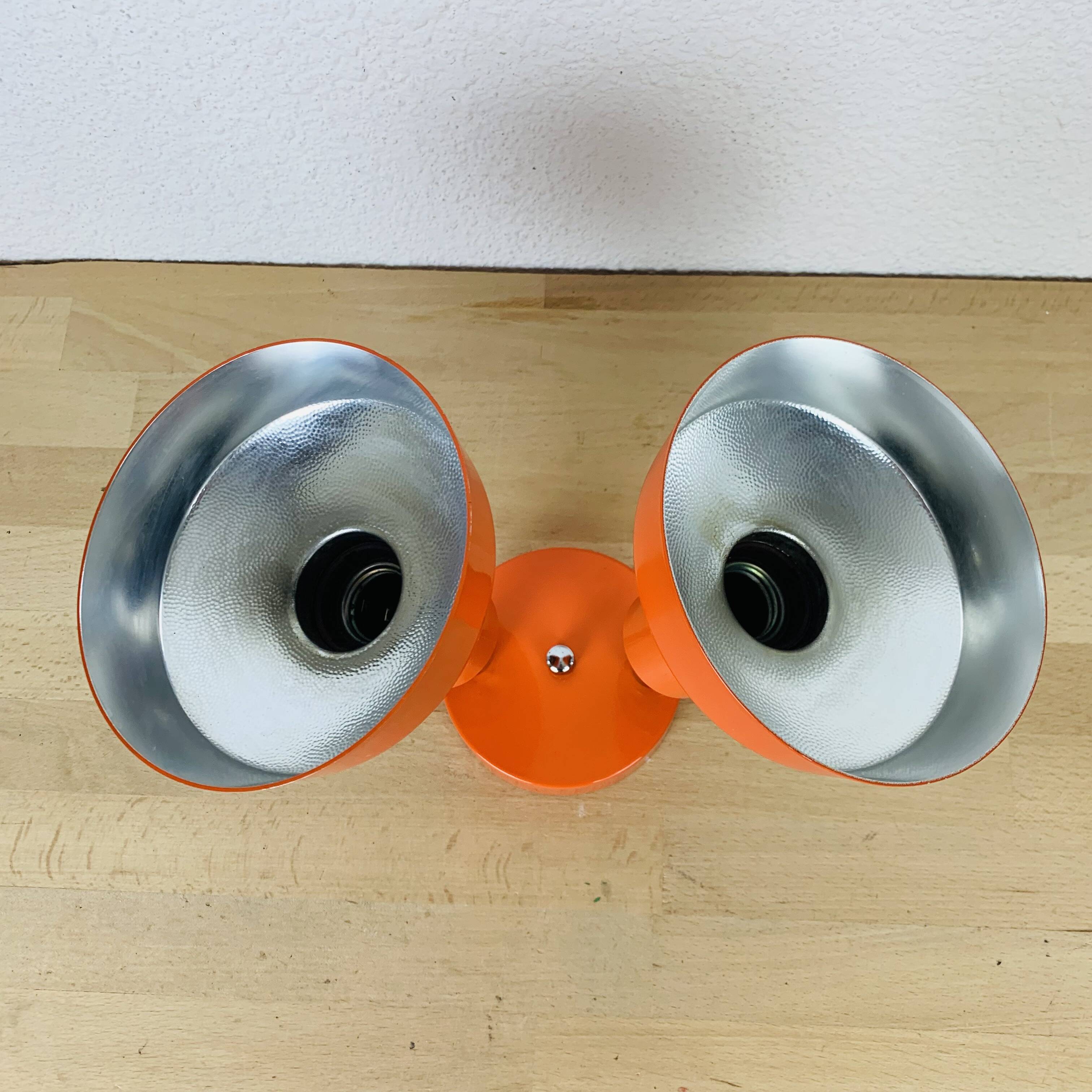 Double adjustable orange spotlight wall lamp from the 70s