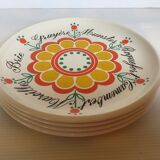 Quatre assiettes à fromages vintage à fleurs