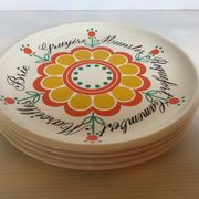 Four vintage floral cheese plates.