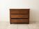 Antique solid wood chest of drawers with a white marble top.