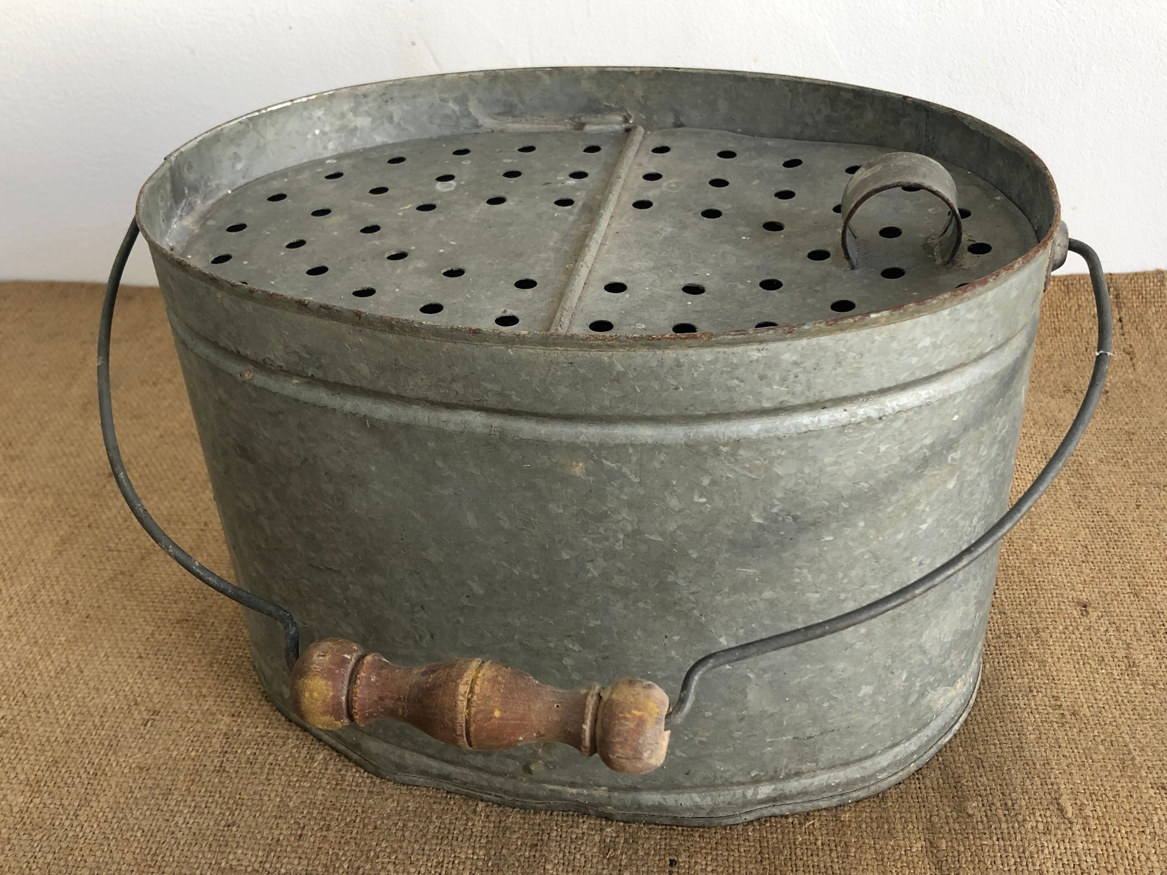 Old zinc stud, fisherman's live bucket