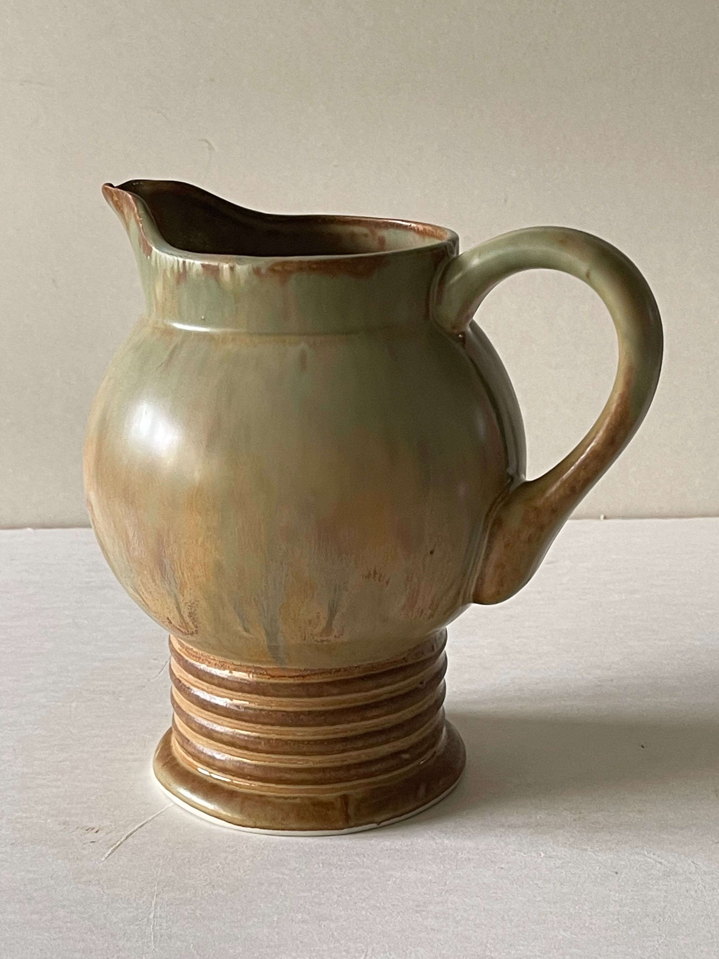 Pitcher in art deco sandstone