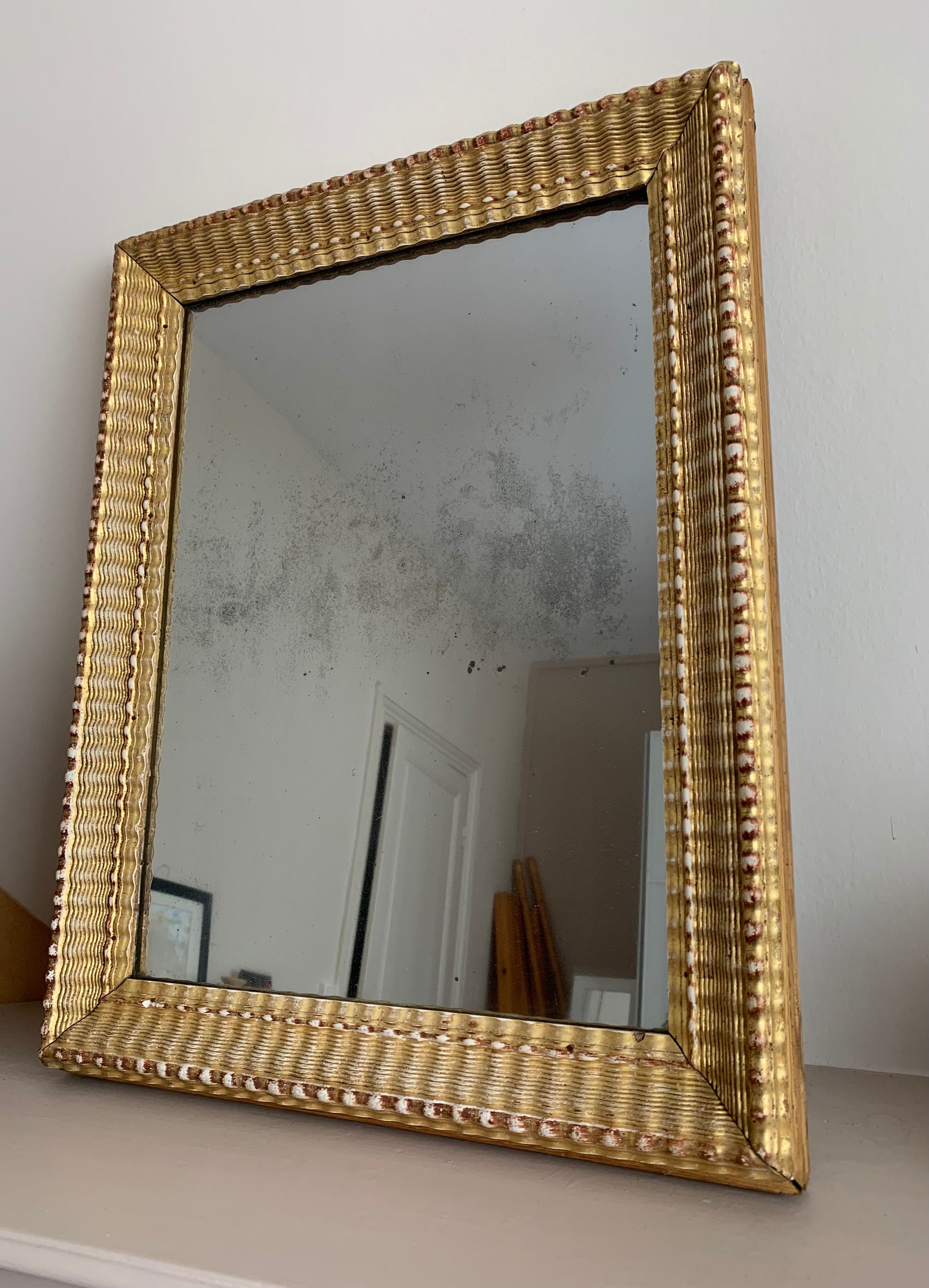 Carved and gilded wooden mirror  44x56cm