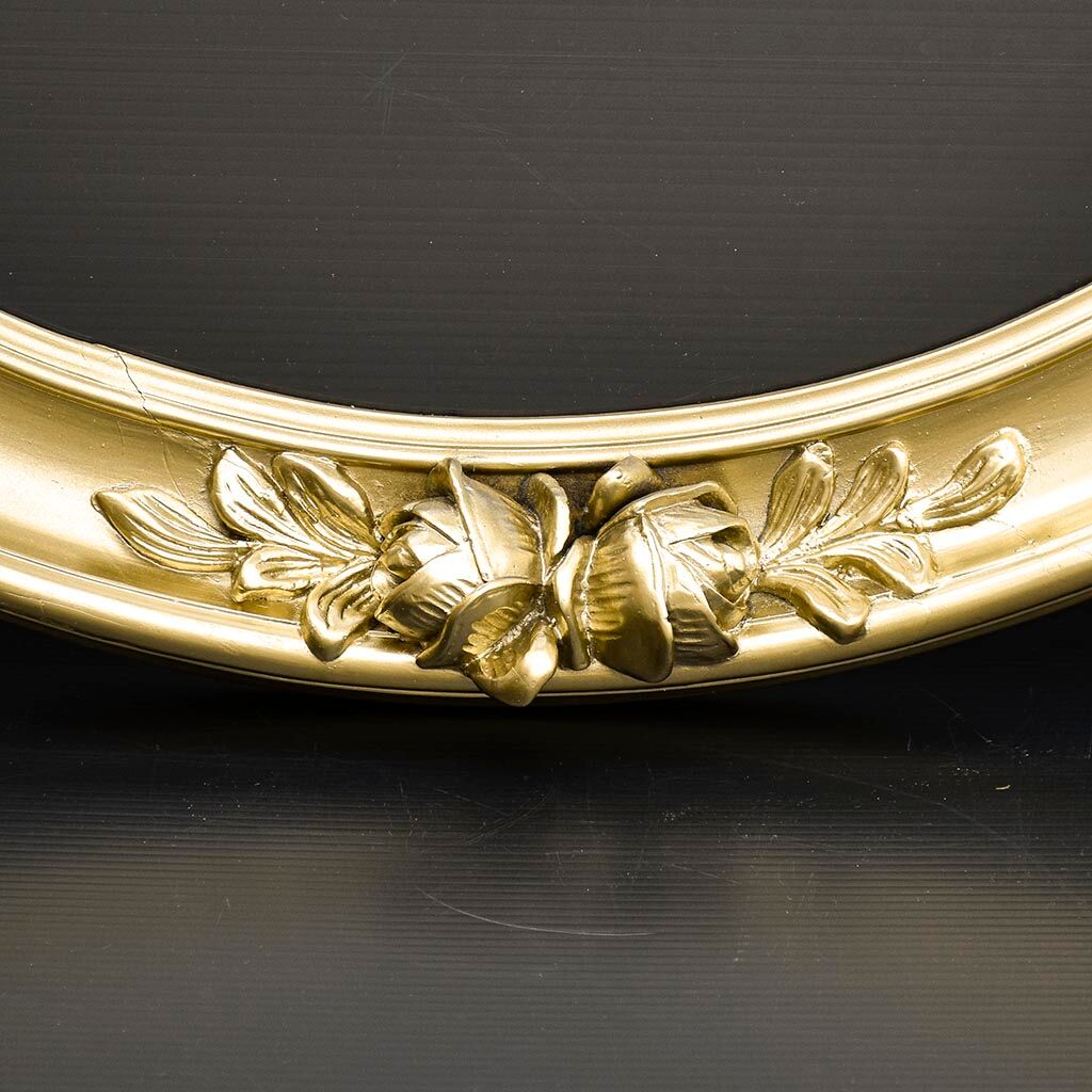 Delightful empty old gilded oval frame with carved wood and stucco flowers 63 x 53