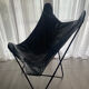 Fauteuil papillon en similicuir en parfait état