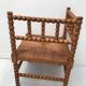 A wooden corner chair turned 1920s