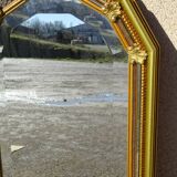 Hall mirror, gilded frame with fillets and fleur-de-lis.