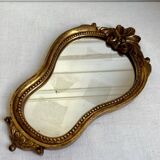 Small golden mirror in baroque style