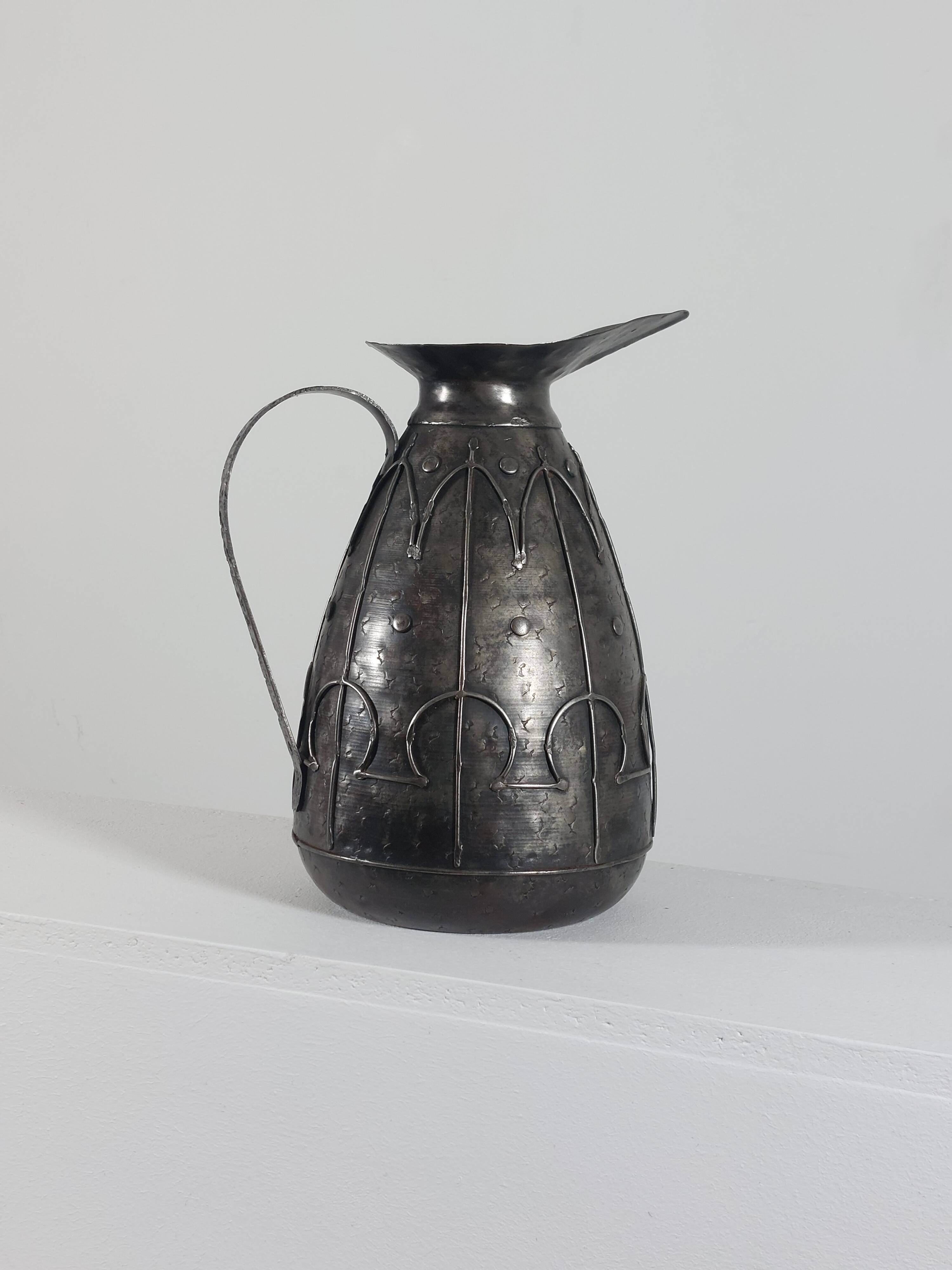 Rare hand-forged metal pitcher and craftsmanship from France.