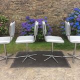 Vintage swivel chairs with chrome tubular base and silver skaï brand unic desing.