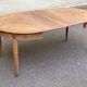 Round extendable dining table stripped in cherry wood with Louis XVI marquetry 1