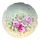 Assiette en porcelaine de Limoges à décor peint de fleurs